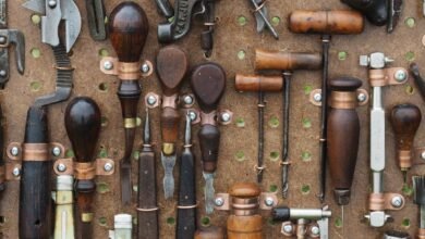 Set of Griffin Tools including wrench, screwdriver, and hammer on a workbench.