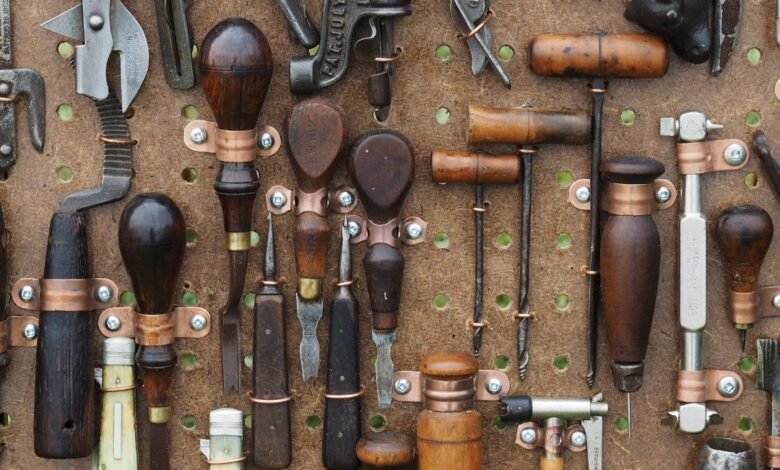 Set of Griffin Tools including wrench, screwdriver, and hammer on a workbench.