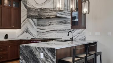 Polished granite slab with natural gray and black speckled pattern.